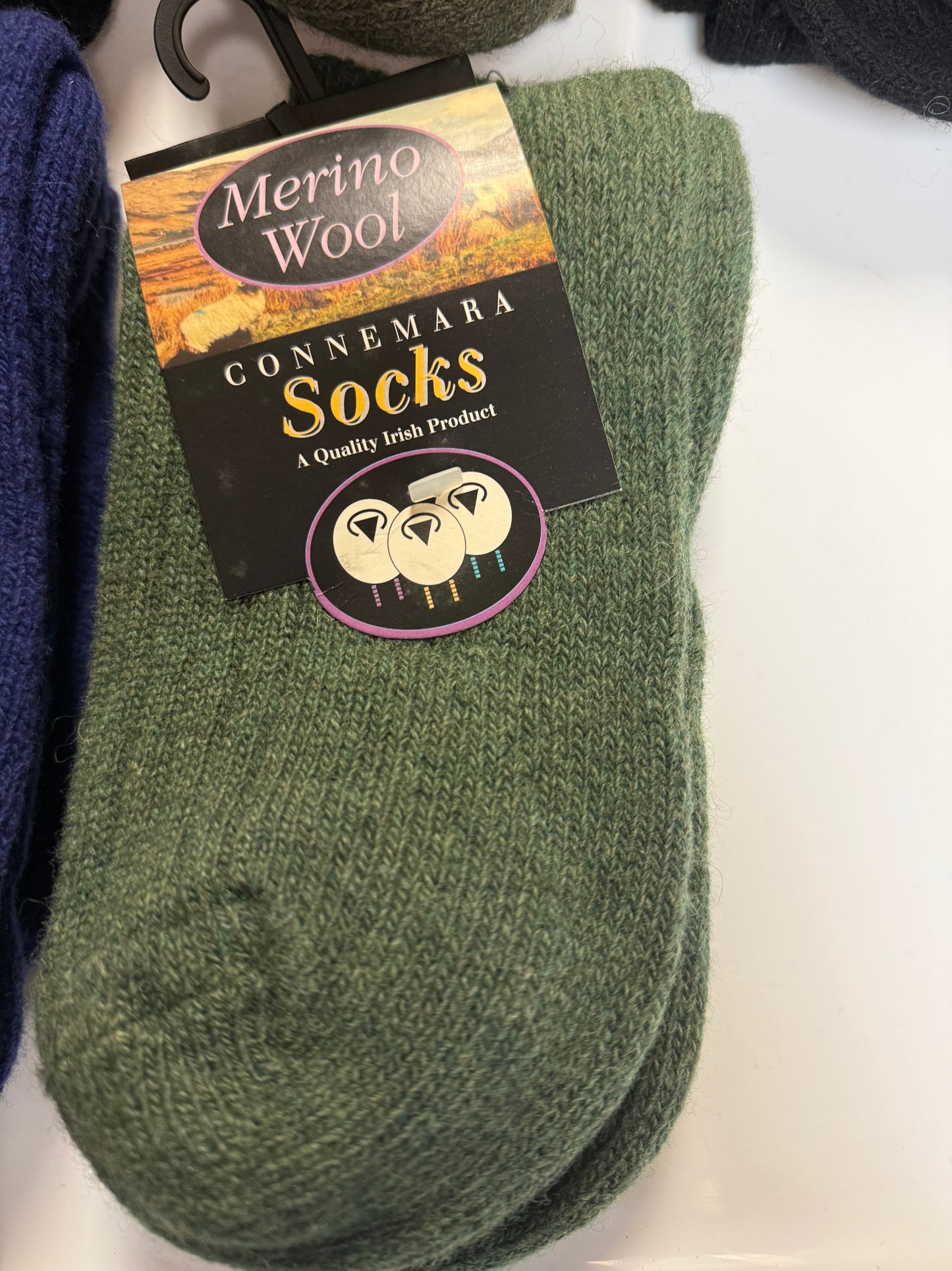 Green socks with a Connemara Socks label on a white background