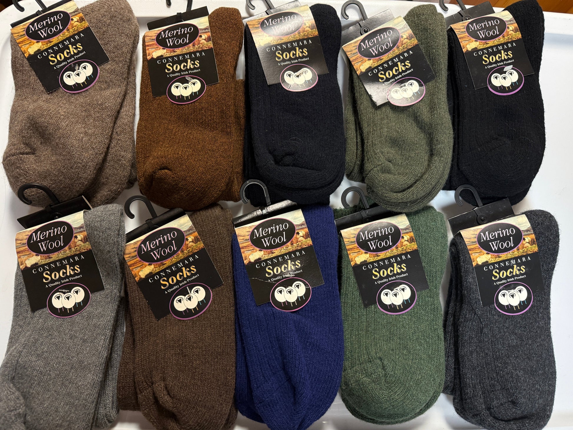 Assorted pairs of socks with labels on a white background